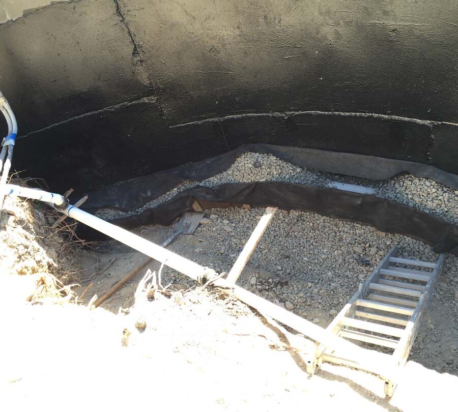 Waterproofing and pipe drainage that is buried is being compacted in place. New electrical pipe connections shown will also be buried out of sight. Pacificland Constructors