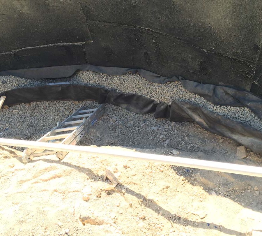 Waterproofing and pipe drainage that is buried is being compacted in place. New electrical pipe connections shown will also be buried out of sight. Pacificland Constructors