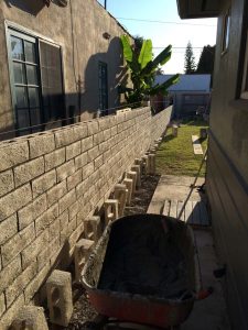 Construction of a new slump block for a home’s side yard. This is a great option to raise the value of your home and create more private living space.