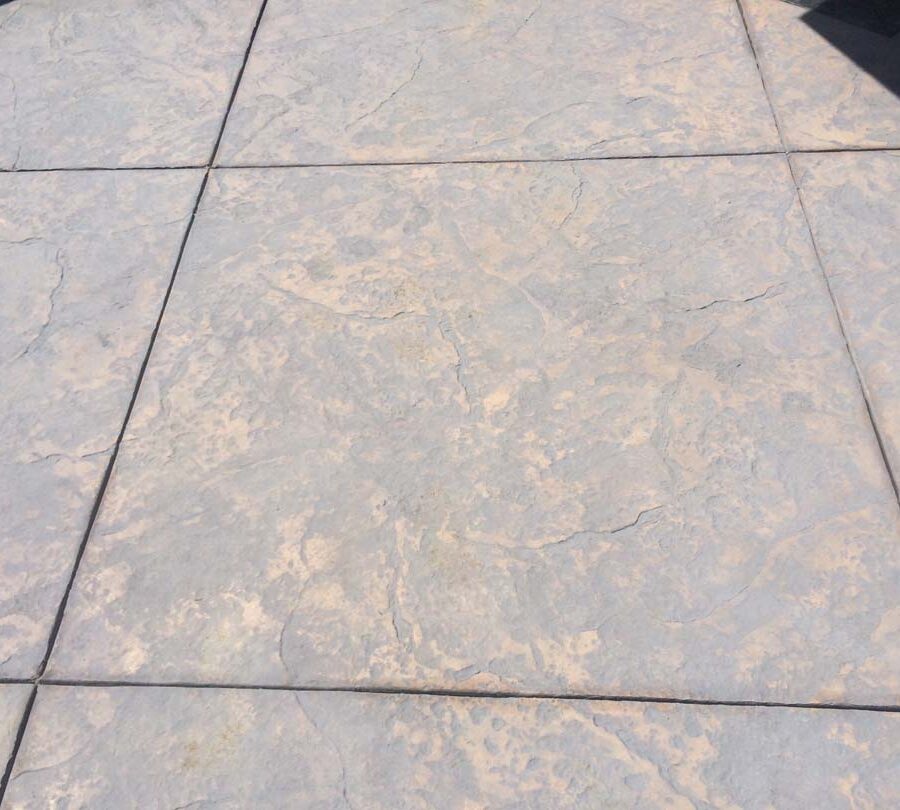 New stamped concrete with hand scorched square joints. Pacificland Constructors