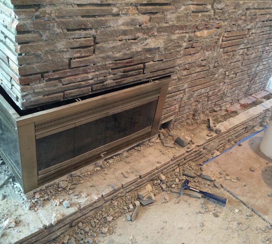 Demolition of existing veneer to prepare and reinforce the chimney for new Stone Veneer. Pacificland Constructors