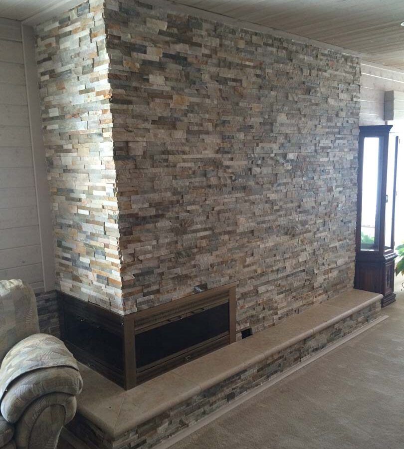 Stone covered chimney gives the home’s living room a modern theme. Pacificland Constructors