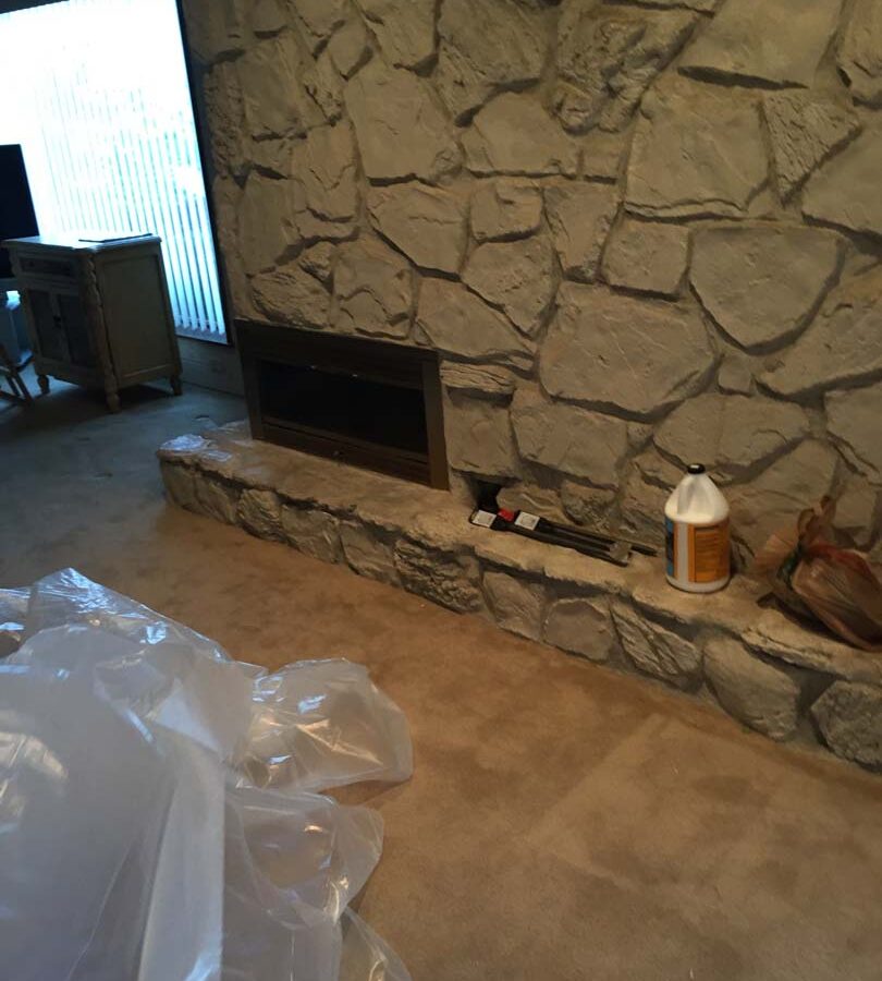 Outdated chimney veneer that was demolished and replaced with new modern style stone veneer. Pacificland Constructors