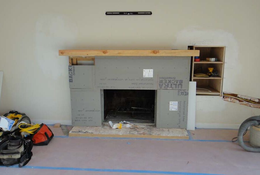 Construction for a stone veneer over the existing fireplace to create a vintage theme for the home. Pacificland Constructors