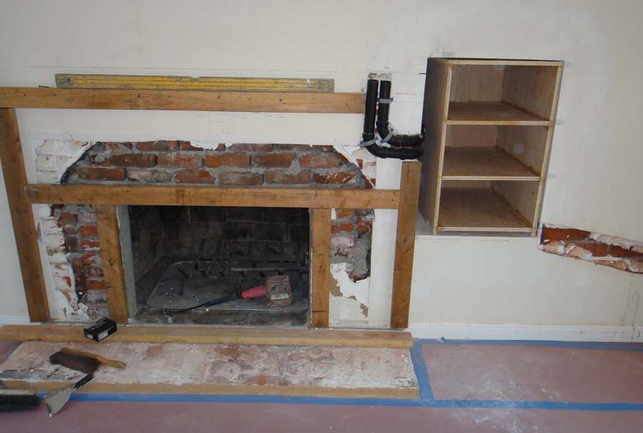 Frame layout construction for a stone veneer over the existing fireplace. Pacificland Constructors