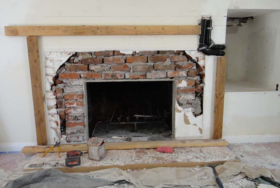 Frame layout construction for a stone veneer over the existing fireplace. Pacificland Constructors