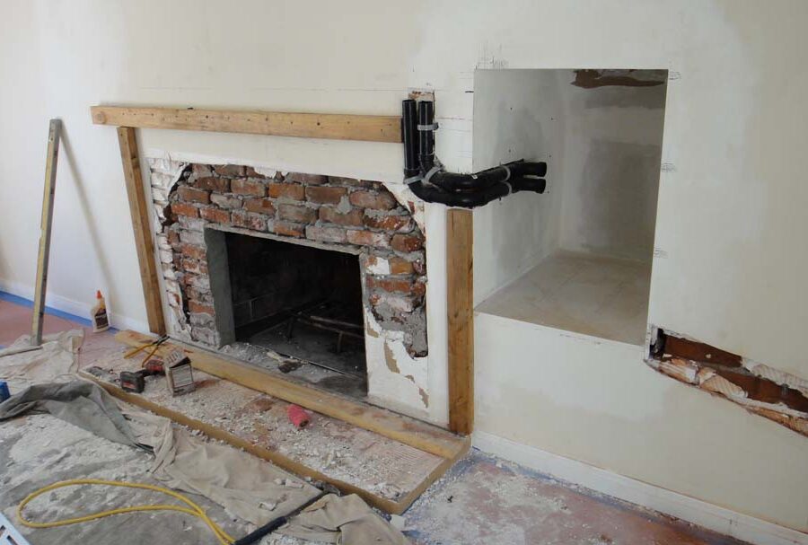 Frame layout construction for a stone veneer over the existing fireplace. Pacificland Constructors