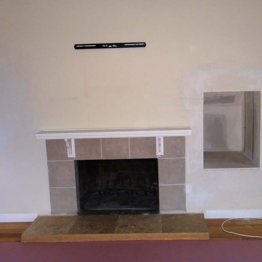 Outdated fireplace for this home that will be demolished. Pacificland Constructors