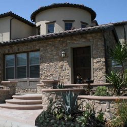 Existing stucco was removed and replaced with new stone veneer to give the home an architecturally vintage look. Pacificland Constructors