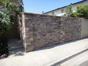 New stone veneer was placed on the face of a new CMU wall to create a bold vintage theme.