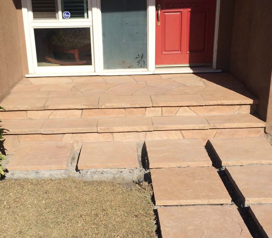 Custom stone cut slabs used as a walkway for a home’s entrance. Pacificland Constructors