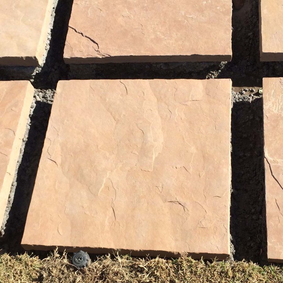 Custom stone cut slabs used as a walkway for a home’s entrance. Pacificland Constructors