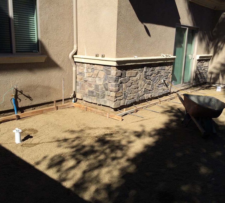 Grading and formwork construction for a new colored stamped concrete backyard in Bellflower, CA. We installed a drainage system throughout the backyard for optimal draining. Pacificland Constructors