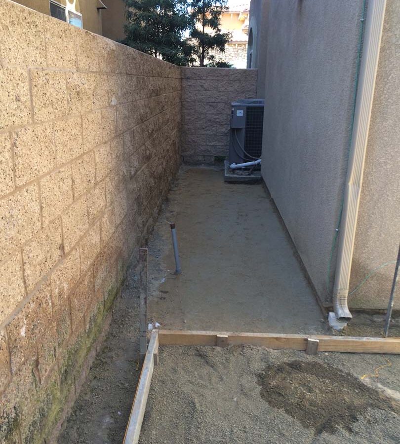 Grading and formwork construction for a new colored stamped concrete backyard in Bellflower, CA. We installed a drainage system throughout the backyard for optimal draining. Pacificland Constructors