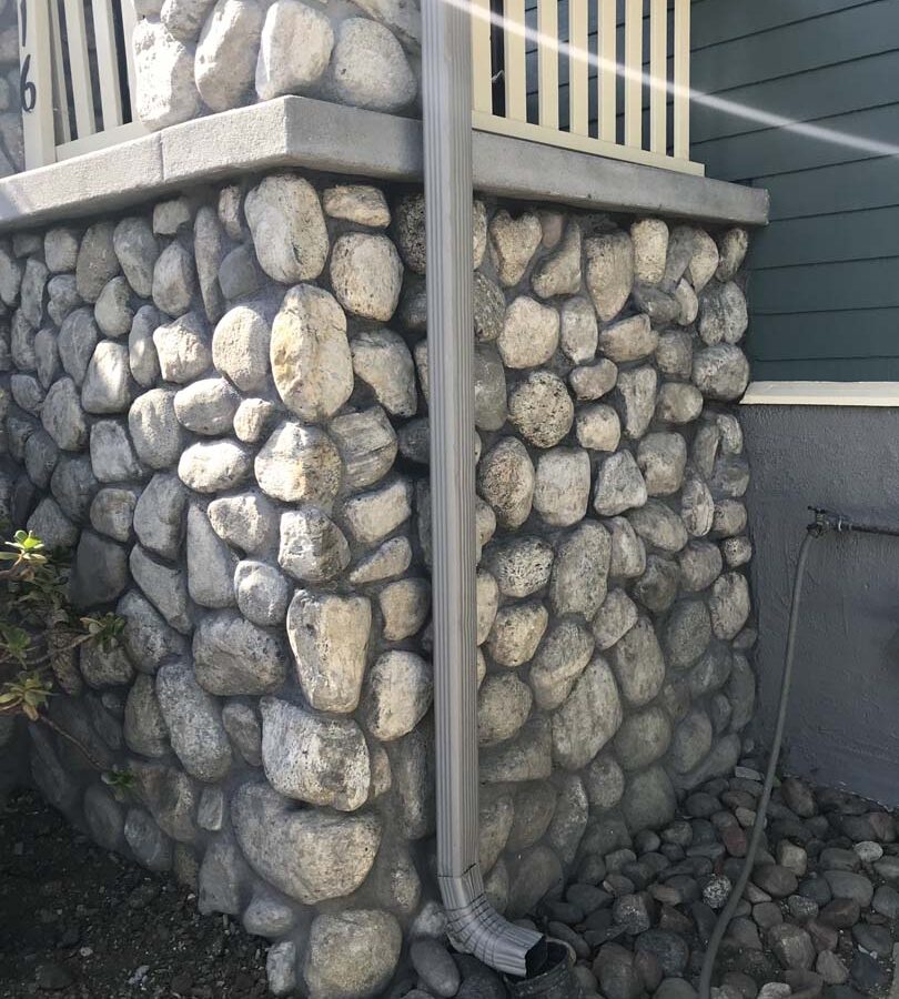 Restored Front porch with new stone veneer. Pacificland Constructors