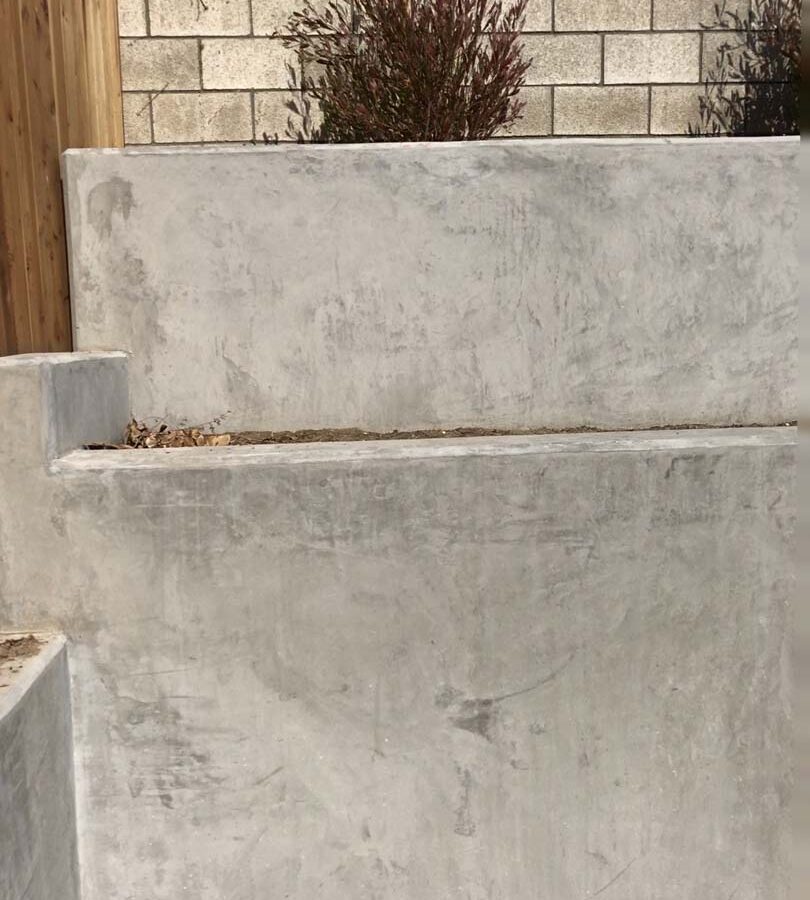 New pour in place concrete retaining wall for a backyard in Huntington Beach, CA. This retaining wall creates more flat area for the home because it holds up the differential earth elevation from the neighbor’s home. Pacificland Constructors