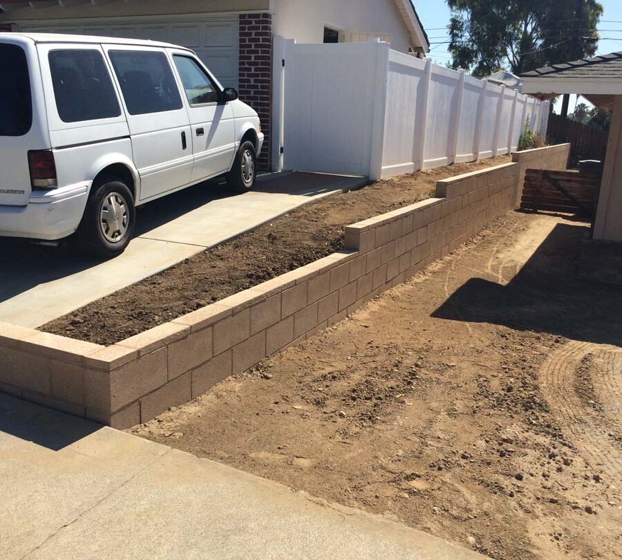 New tan precision block retaining wall. Pacificland Constructors