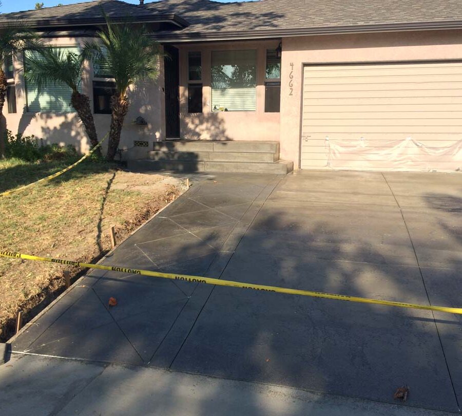 New driveway with a handmade diagonal pattern along the walkway to the house. Pacificland Constructors