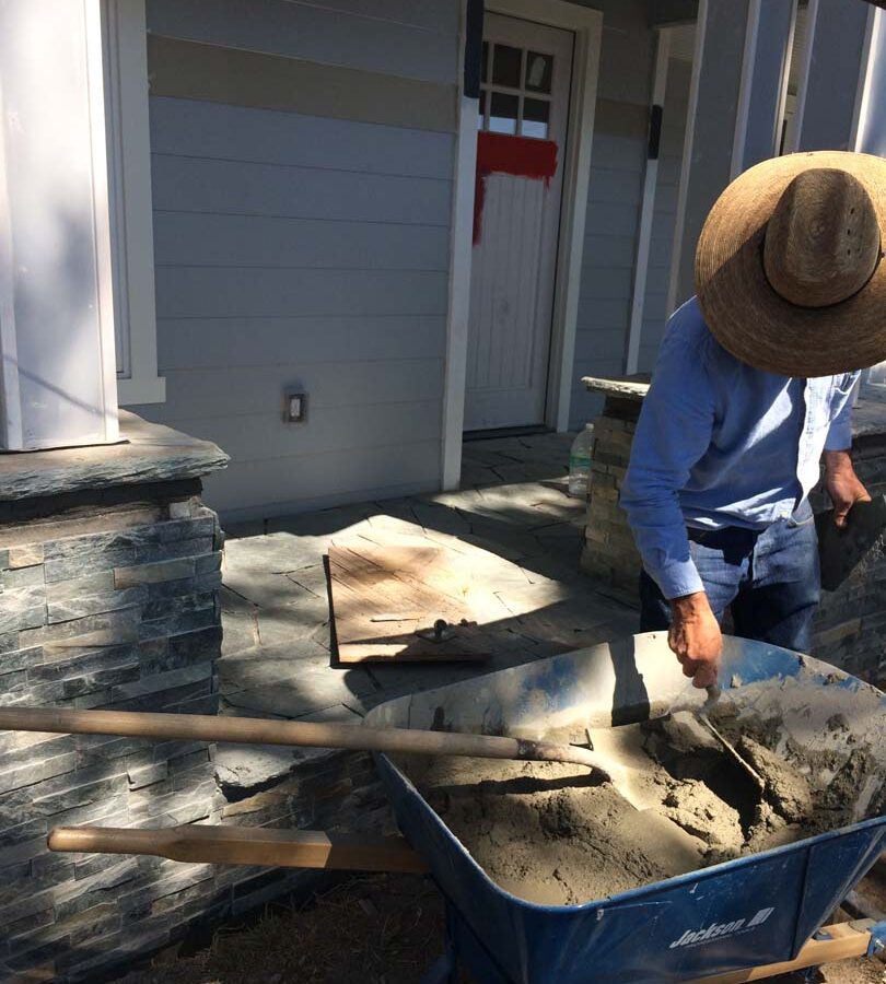 Martin, founder of Pacificland, installing a new flagstone walkway for a home’s front yard’s porch landing. Flagstone work is a great option to raise the value of your home. Pacificland Constructors