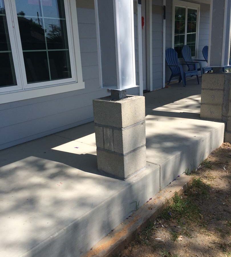 The owner of this home wanted to cover their pilasters at the bottom of each post with stone veneer and install new flagstone over the concrete. We helped them build this upgrade to their home. Pacificland Constructors