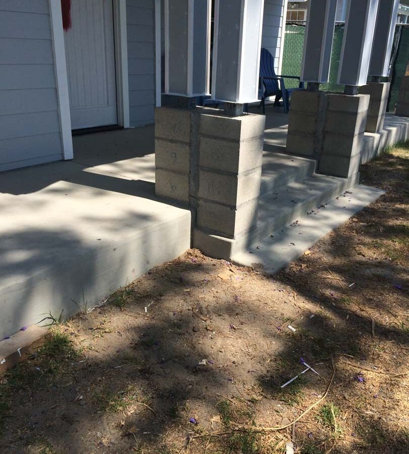 The owner of this home wanted to cover their pilasters at the bottom of each post with stone veneer and install new flagstone over the concrete. We helped them build this upgrade to their home. Pacificland Constructors