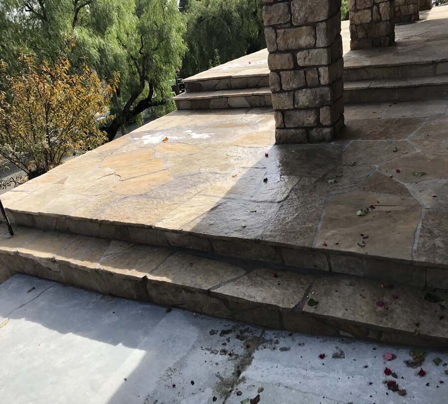 Stone veneered pilasters and walls that match flagstone flatwork for a home’s porch in San Pedro, CA. Pacificland Constructors