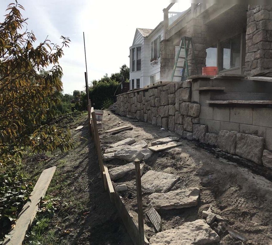 Construction of stone veneered cmu walls and pilasters that will match flagstone flatwork selected by the owner for their home’s porch. Pacificland Constructors