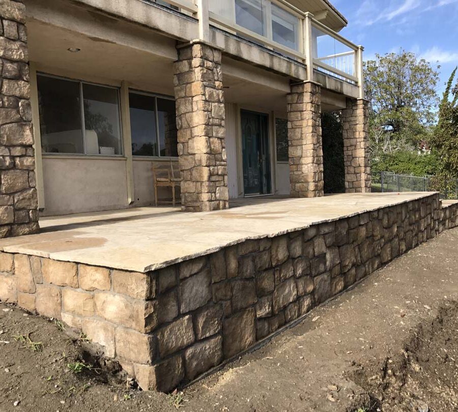 Stone covered pilasters and walls that match flagstone flatwork. Pacificland Constructors