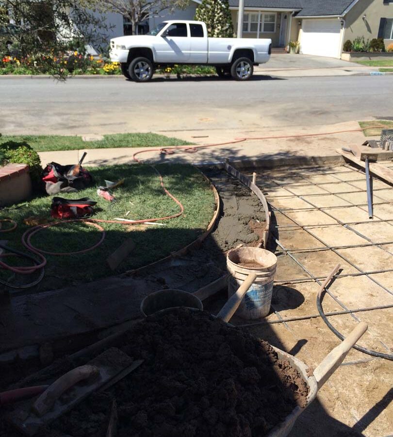 Steel reinforcement for a new colored concrete driveway. It will have a diamond pattern and a contrasting ribbon around the perimeter. The surface will be broom swept and have hand scorched joints. Pacificland Constructors